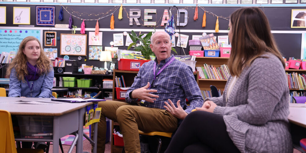 Professor working with students in an elementary school classroom!