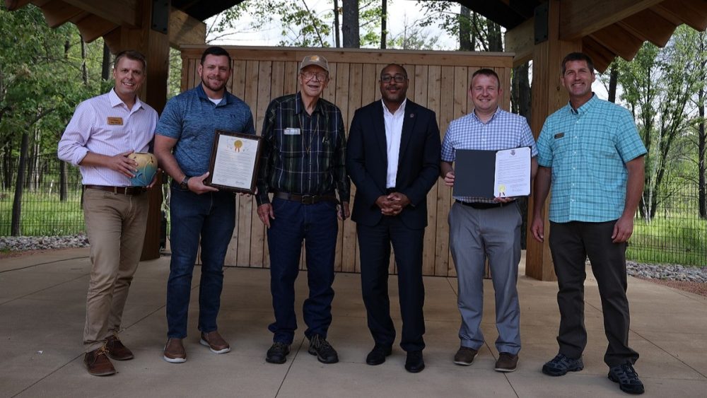 Attending a ceremony honoring Professor Emeritus Bob Freckman at Schmeeckle Reserve were, from left, Executive Director of Gathering Waters Mike Carlson, Sen. Patrick Testin, Bob Freckmann, Chancellor Thomas Gibson, Stevens Point Parks Director Dan Kremer and NCCT Executive Director Chris Radford.
