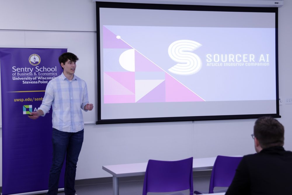 Suscha presents his pitch for Sourcer AI to advisers within the Sentry School of Business and Economics.