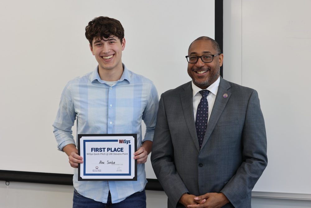 Alex Suscha, pictured with Chancellor Tom Gibson, earned first place at the UW-Stevens Point WiSys Quick Pitch competition May 3 for his pitch titled “Sourcer AI - Article Integrity Companion.”